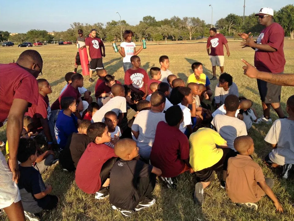 Team huddle with coaches